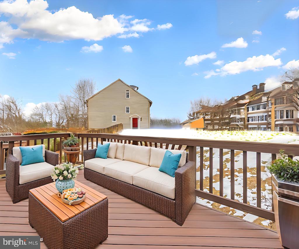 8735 Stone Hill Place Springfield, VA 22153 - Photo 7 of 51 a view of a balcony with wooden floor and seating space