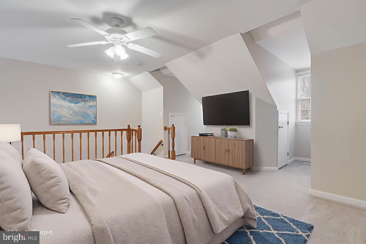 8735 Stone Hill Place Springfield, VA 22153 - Photo 9 of 51 a bedroom with a bed tv and a window