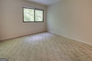 3782 Mulkey Circle Southwest, Unit 18 Austell, GA 30106 - Photo 11 of 54 an empty room with a window
