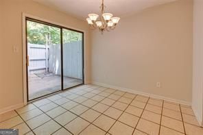 3782 Mulkey Circle Southwest, Unit 18 Austell, GA 30106 - Photo 20 of 54 a view of an empty room with a chandelier