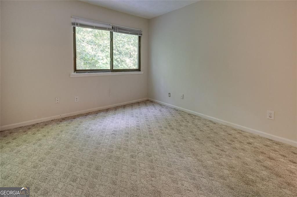 3782 Mulkey Circle Southwest, Unit 18 Austell, GA 30106 - Photo 38 of 54 an empty room with a window