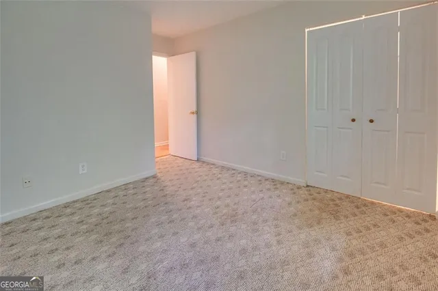 a kitchen with a stove cabinets and a refrigerator