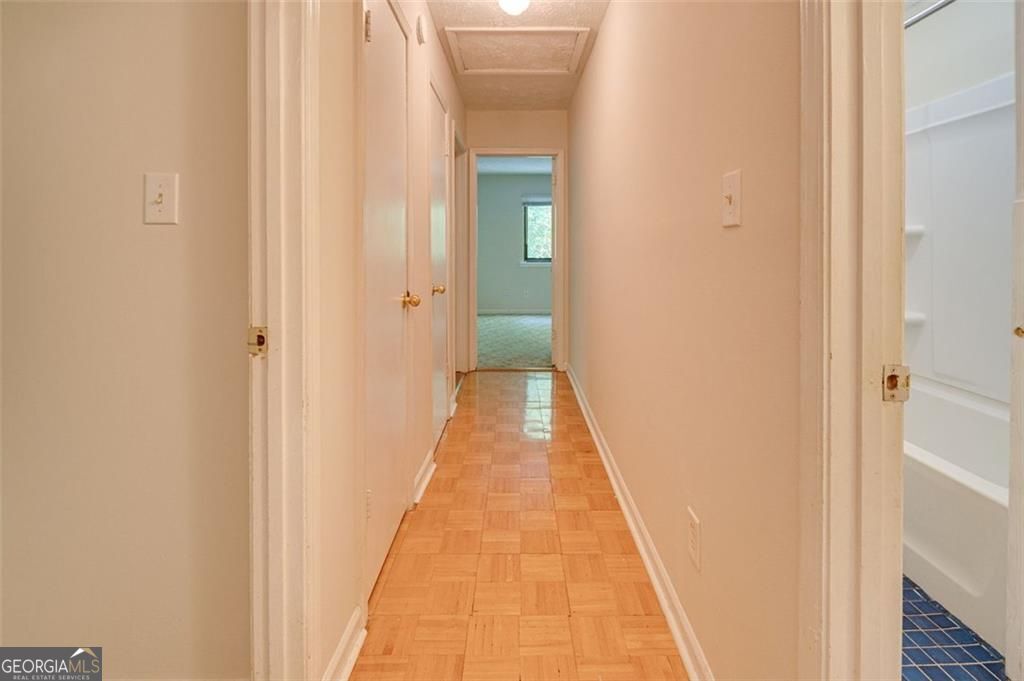 3782 Mulkey Circle Southwest, Unit 18 Austell, GA 30106 - Photo 43 of 54 a view of a hallway with wooden floor