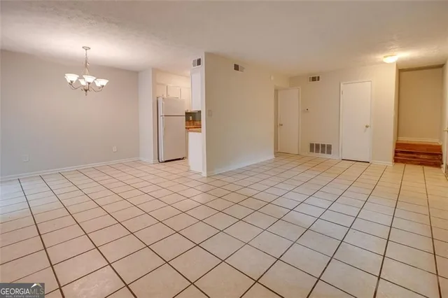 a view of an empty room and window