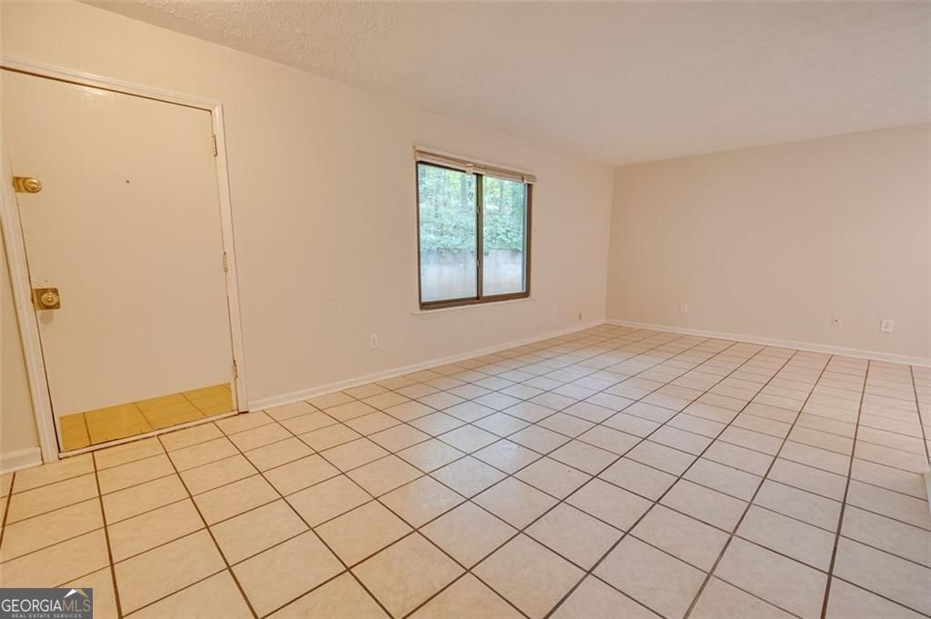 3782 Mulkey Circle Southwest, Unit 18 Austell, GA 30106 - Photo 52 of 54 a view of an empty room and window