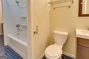 a white toilet sitting next to a bath tub