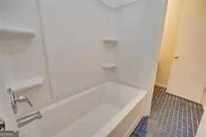 a bathroom with a bathtub