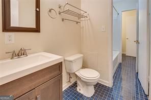 3782 Mulkey Circle Southwest, Unit 18 Austell, GA 30106 - Photo 9 of 54 a bathroom with a sink toilet and shower