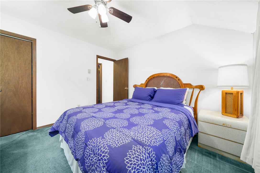 222 Powder Horn Road Henryville, PA 18332 - Photo 13 of 25 A comfortable bedroom features high ceilings and soft carpet for a peaceful retreat.