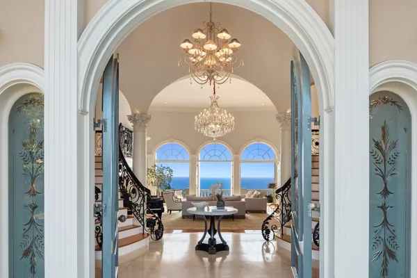 a living room with furniture and flowers