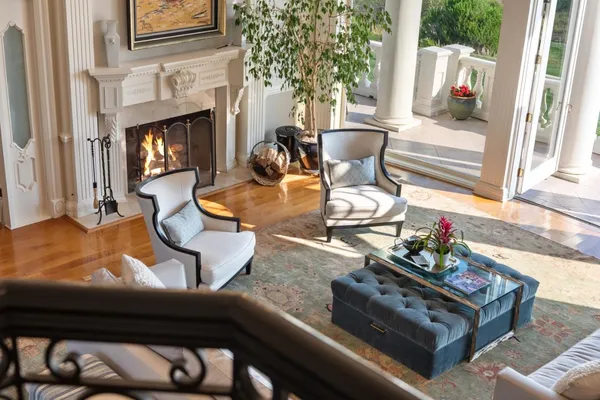 a outdoor sitting area with furniture and a potted plant