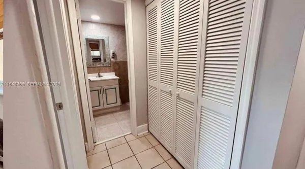 a view of a bathroom from a hallway