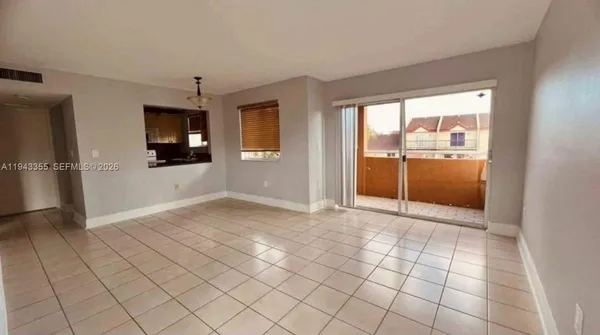 a view of an empty room and window