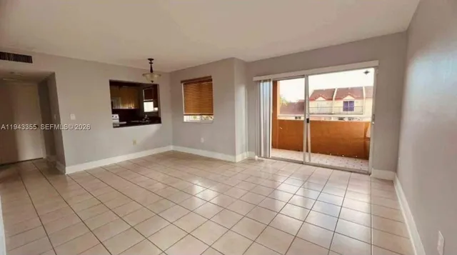 a view of an empty room and window