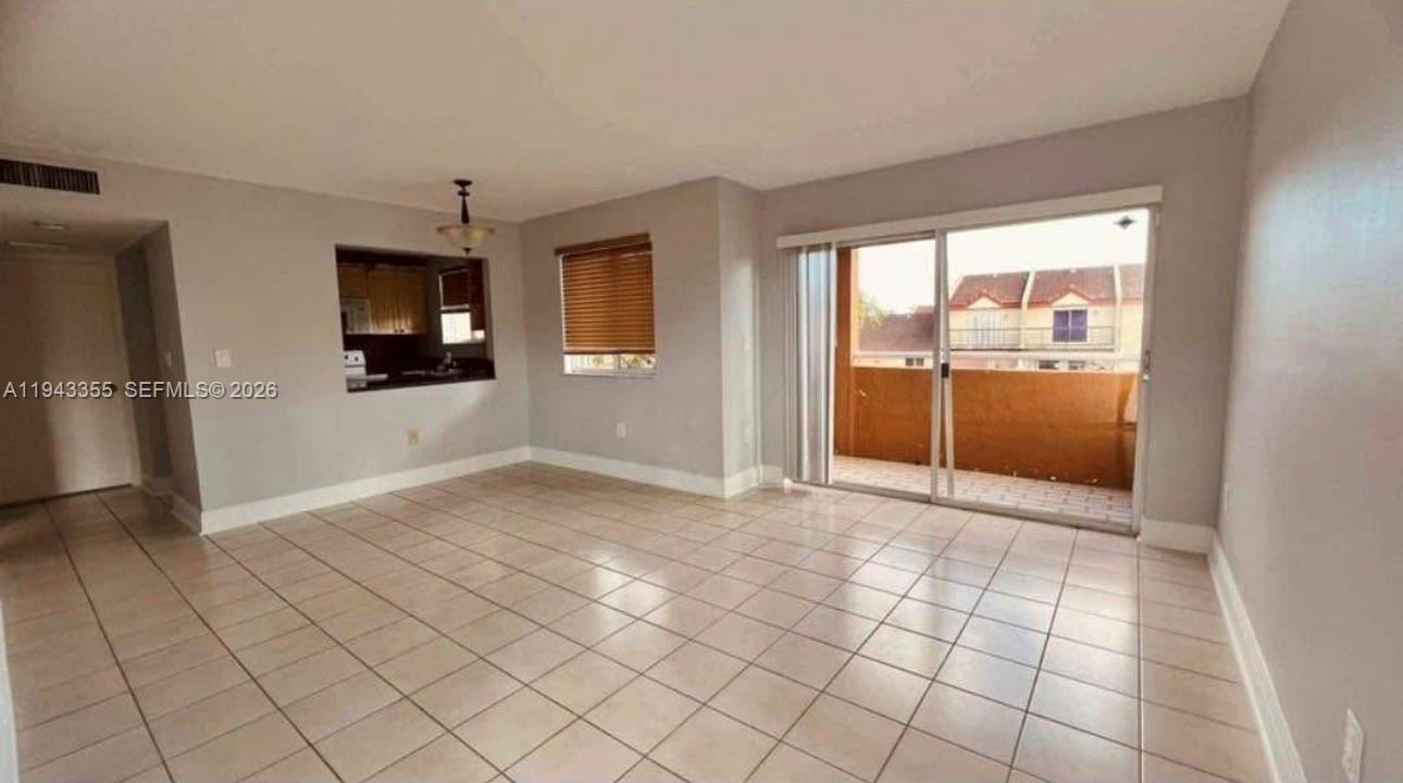 6221 Southwest 131st Court, Unit 204 Miami, FL 33183 - Photo 2 of 12 a view of an empty room and window