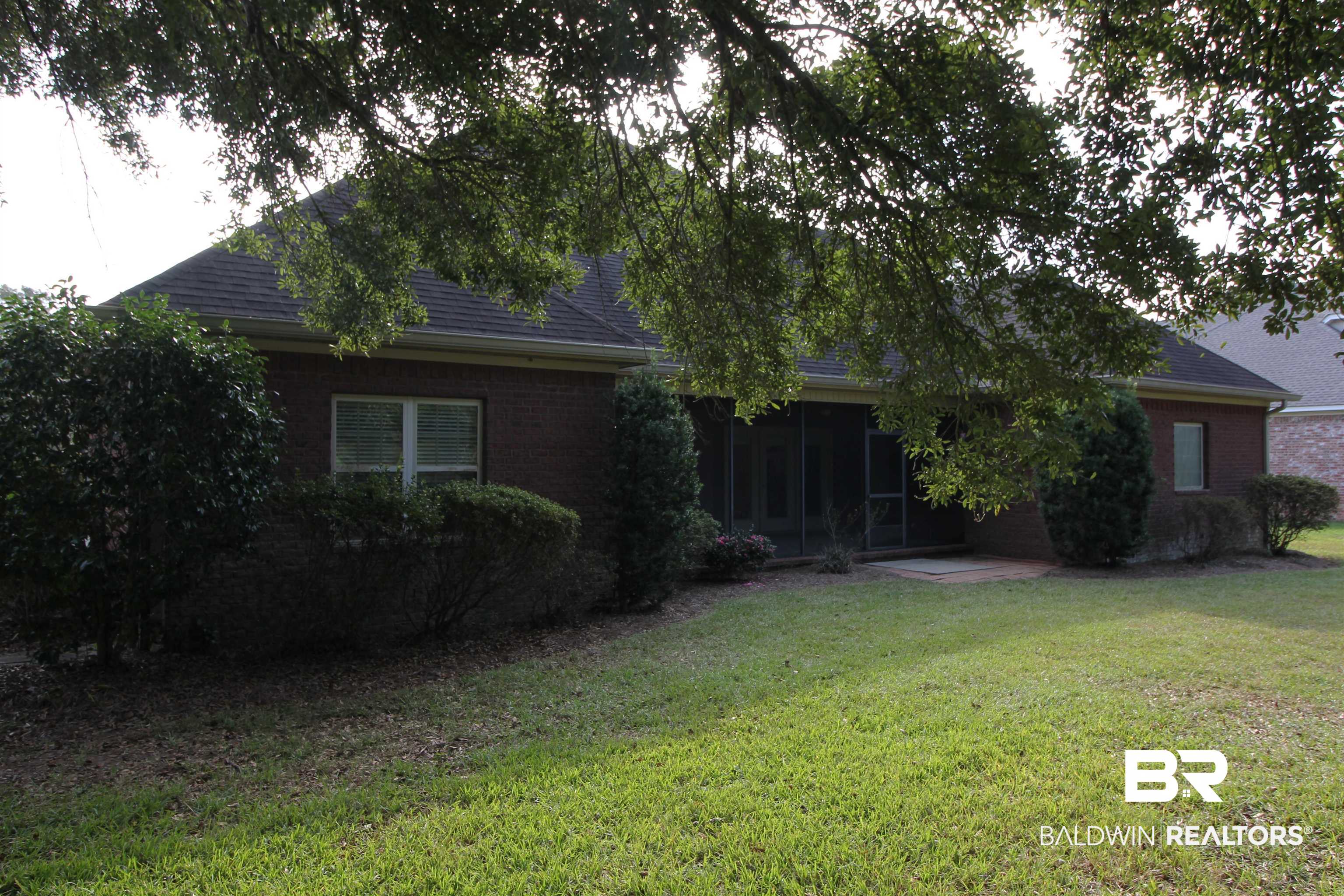 306 South Tee Drive Fairhope, AL 36532 - Photo 7 of 37 Obstructed view of property with a front yard and a sunroom