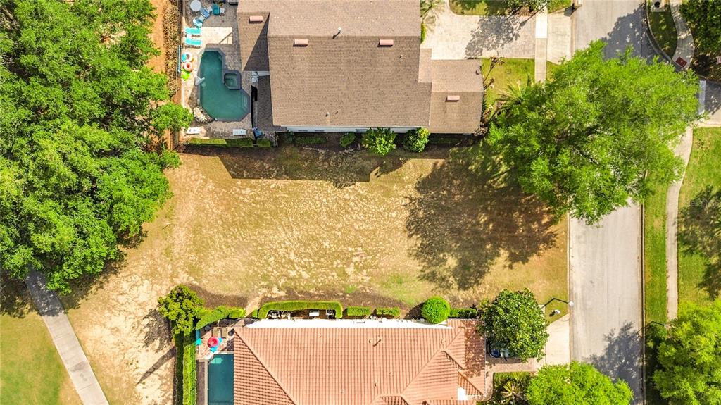 1233 Radiant Street Reunion, FL 34747 - Photo 4 of 18 an aerial view of a house with yard and garage