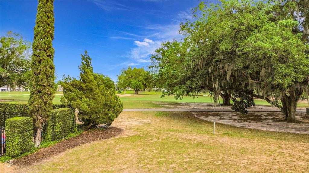1233 Radiant Street Reunion, FL 34747 - Photo 7 of 18 a view of a swimming pool with an outdoor space and seating area