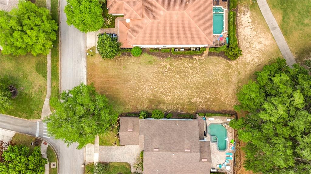 1233 Radiant Street Reunion, FL 34747 - Photo 9 of 18 an aerial view of residential house with pool and garden
