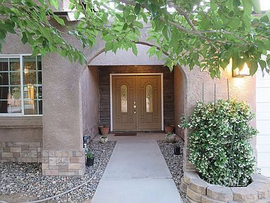 219 Larkspur Street Ridgecrest, CA 93555 - Photo 2 of 34 a front view of a house with garden