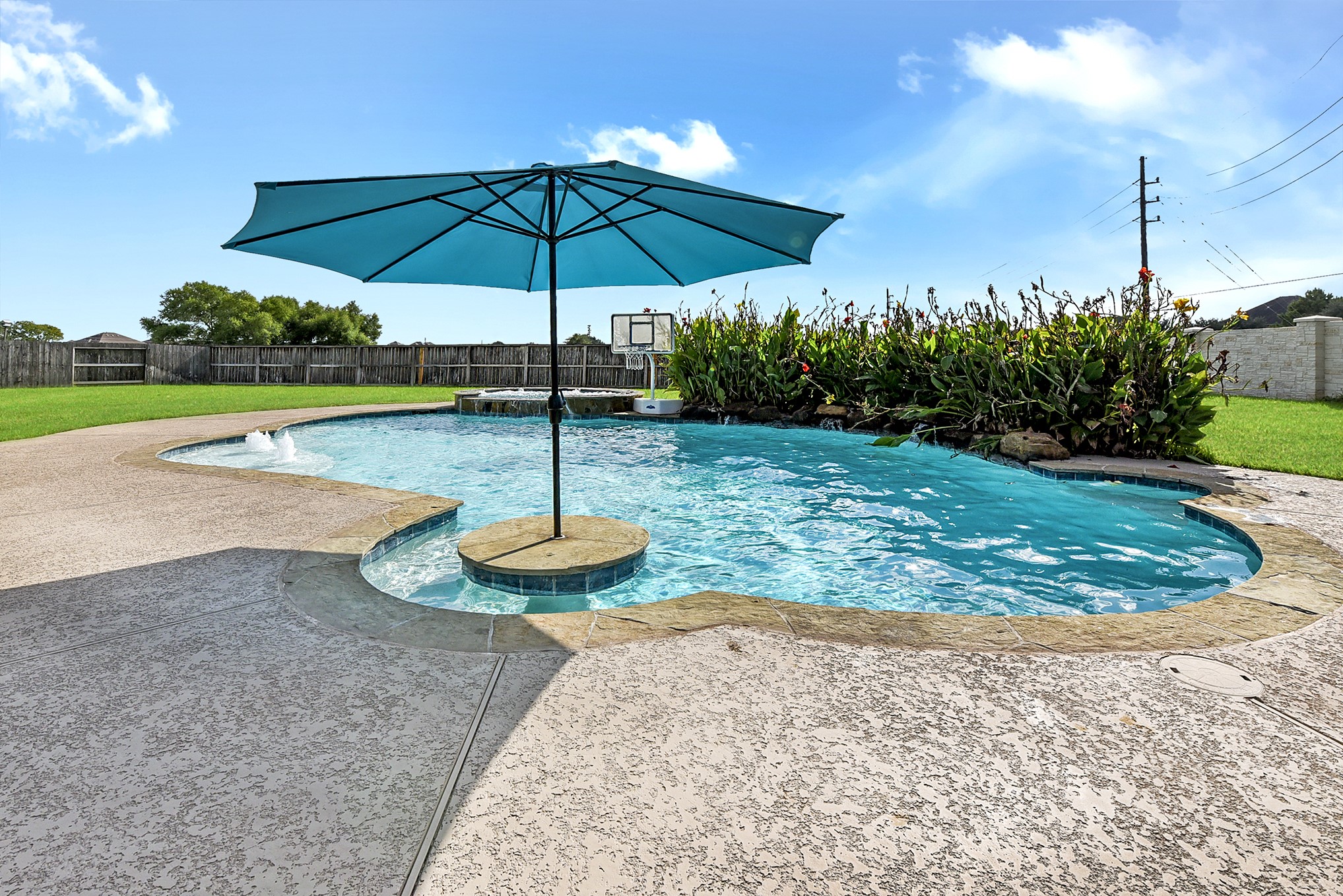 2951 Bobby Jones Road Katy, TX 77494 - Photo 1 of 50 Set on a beautiful lot spanning over one-third of an acre, this exceptional home offers an impressive private backyard designed for enjoying the outdoors year-round. The expansive outdoor retreat features a large covered patio, sun deck, heated pool and spa, and beautifully maintained landscaping. Beyond the pool area, generous green space provides endless possibilities for a future pool house or casita, soccer field, garden, play area, or additional outdoor living space.
