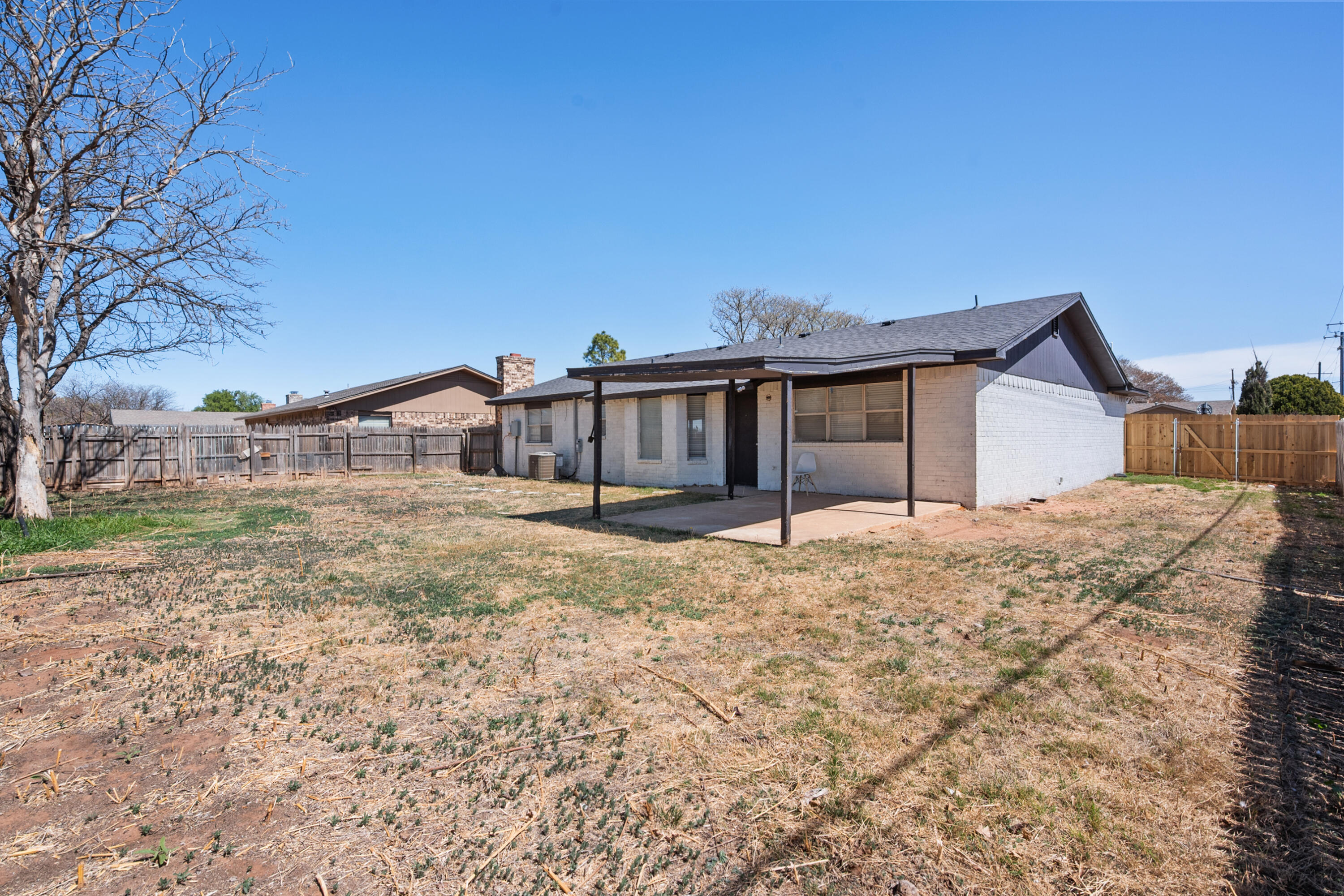 8110 Uvalde Avenue Lubbock, TX 79423 - Photo 11 of 11 a front view of a house with a yard