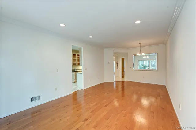 an empty room with windows and entrance