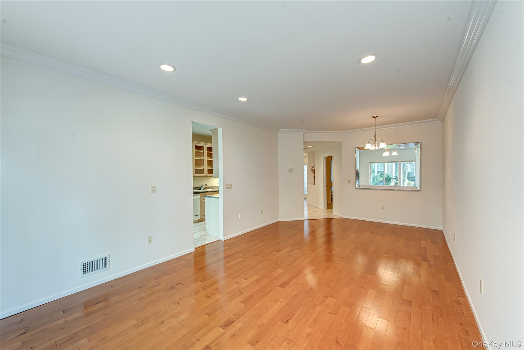 93 Carriage Lane, Unit AVON LOWER Plainview, NY 11803 - Photo 11 of 36 an empty room with windows and entrance