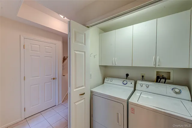 a view of storage and utility room with washer and dryer