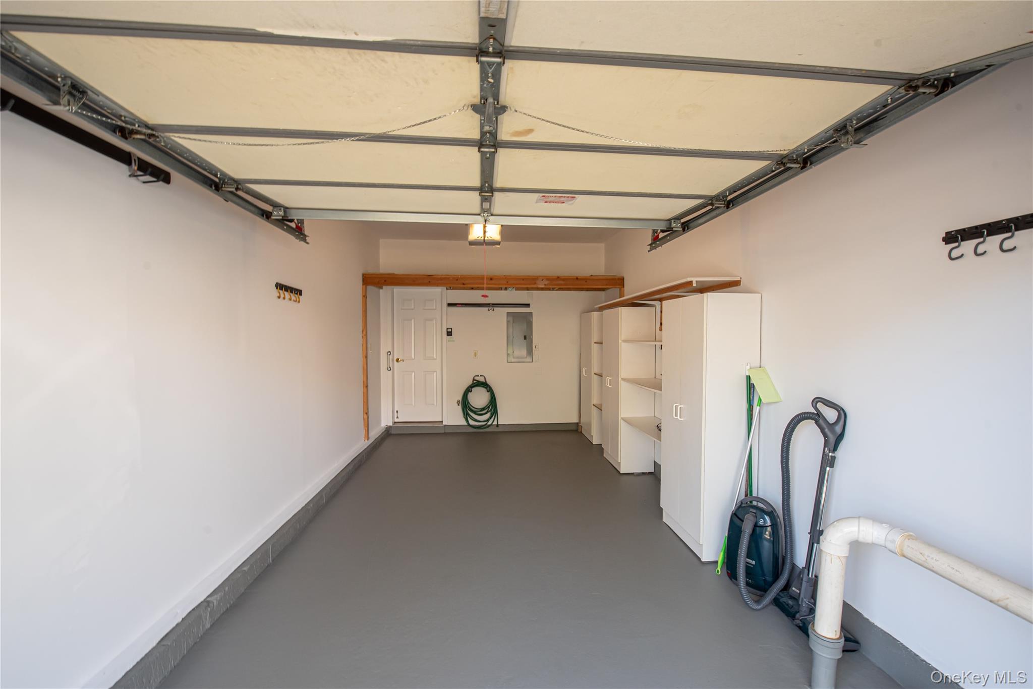 93 Carriage Lane, Unit AVON LOWER Plainview, NY 11803 - Photo 24 of 36 a view of a room with gym equipment