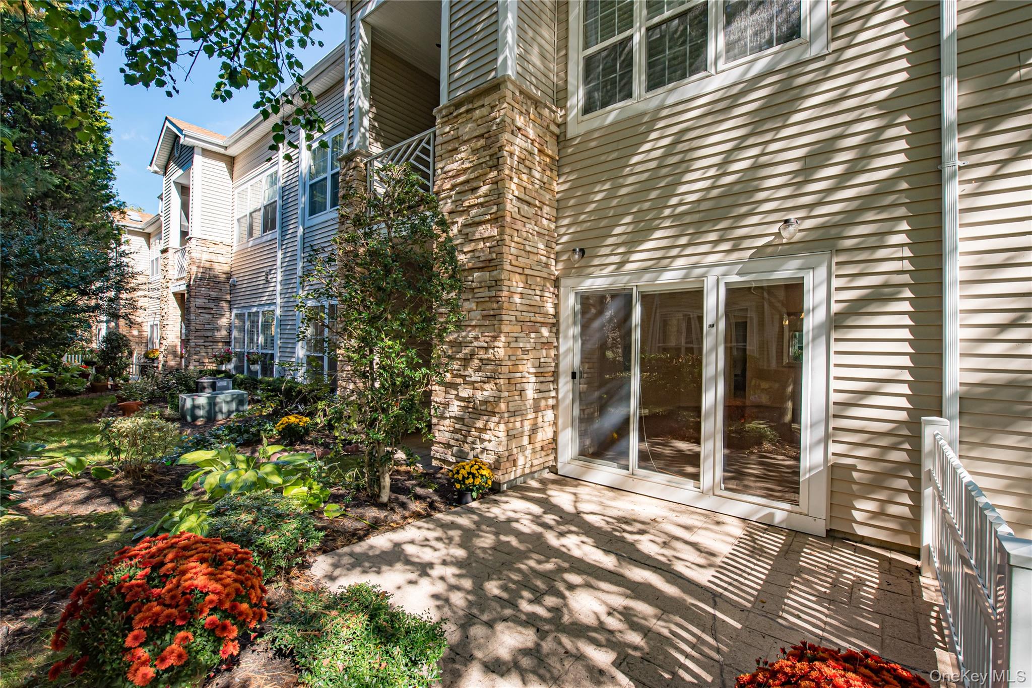 93 Carriage Lane, Unit AVON LOWER Plainview, NY 11803 - Photo 26 of 36 a view of house with a outdoor space