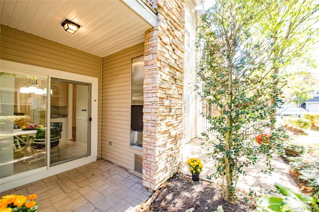 a living room with fireplace furniture and a chandelier