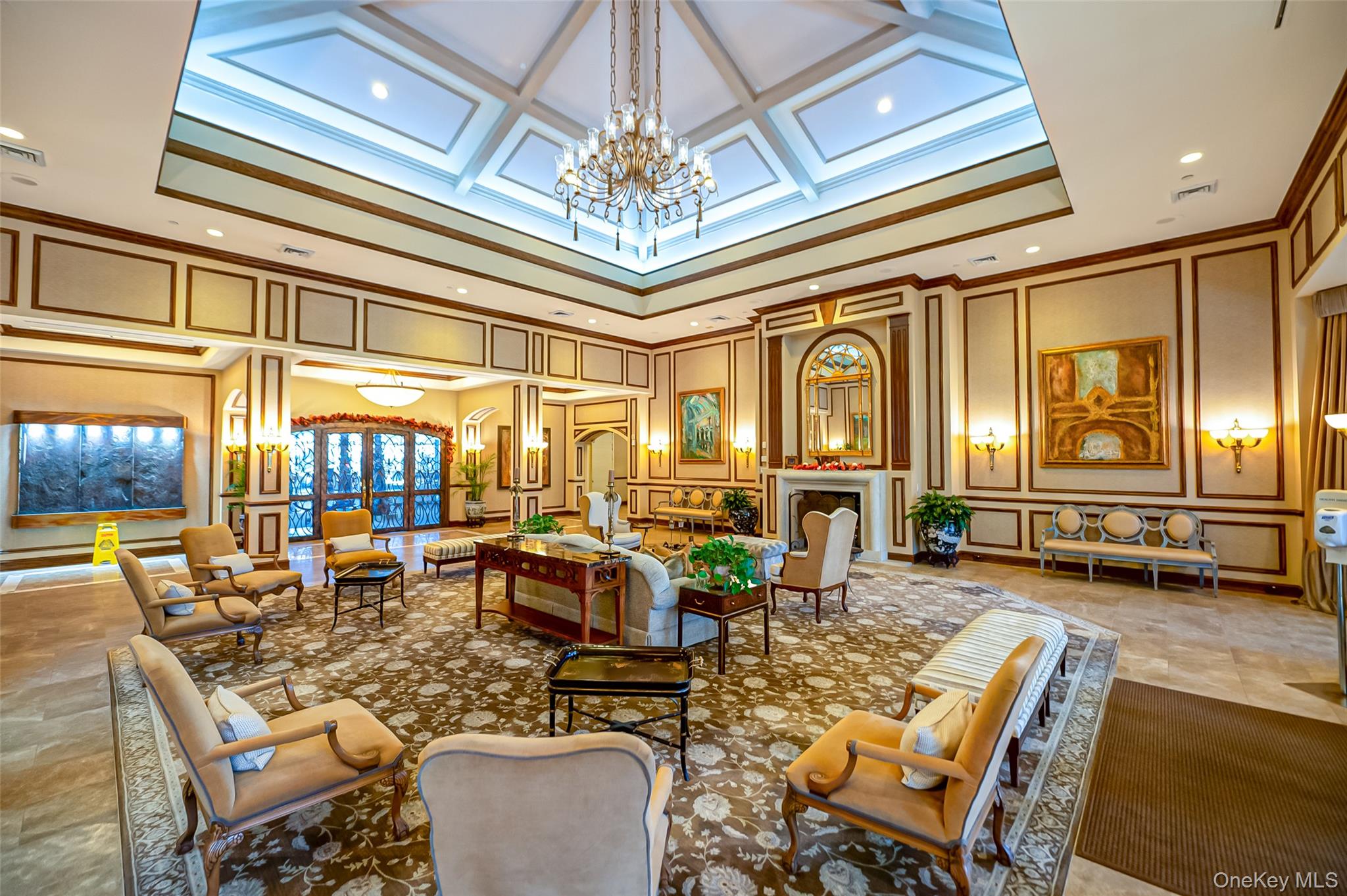 93 Carriage Lane, Unit AVON LOWER Plainview, NY 11803 - Photo 31 of 36 a living room with fireplace furniture and a chandelier