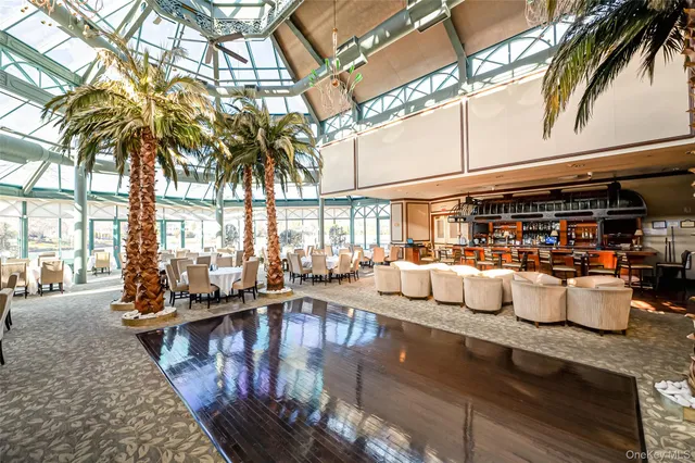 a group of people sitting on tables in a room