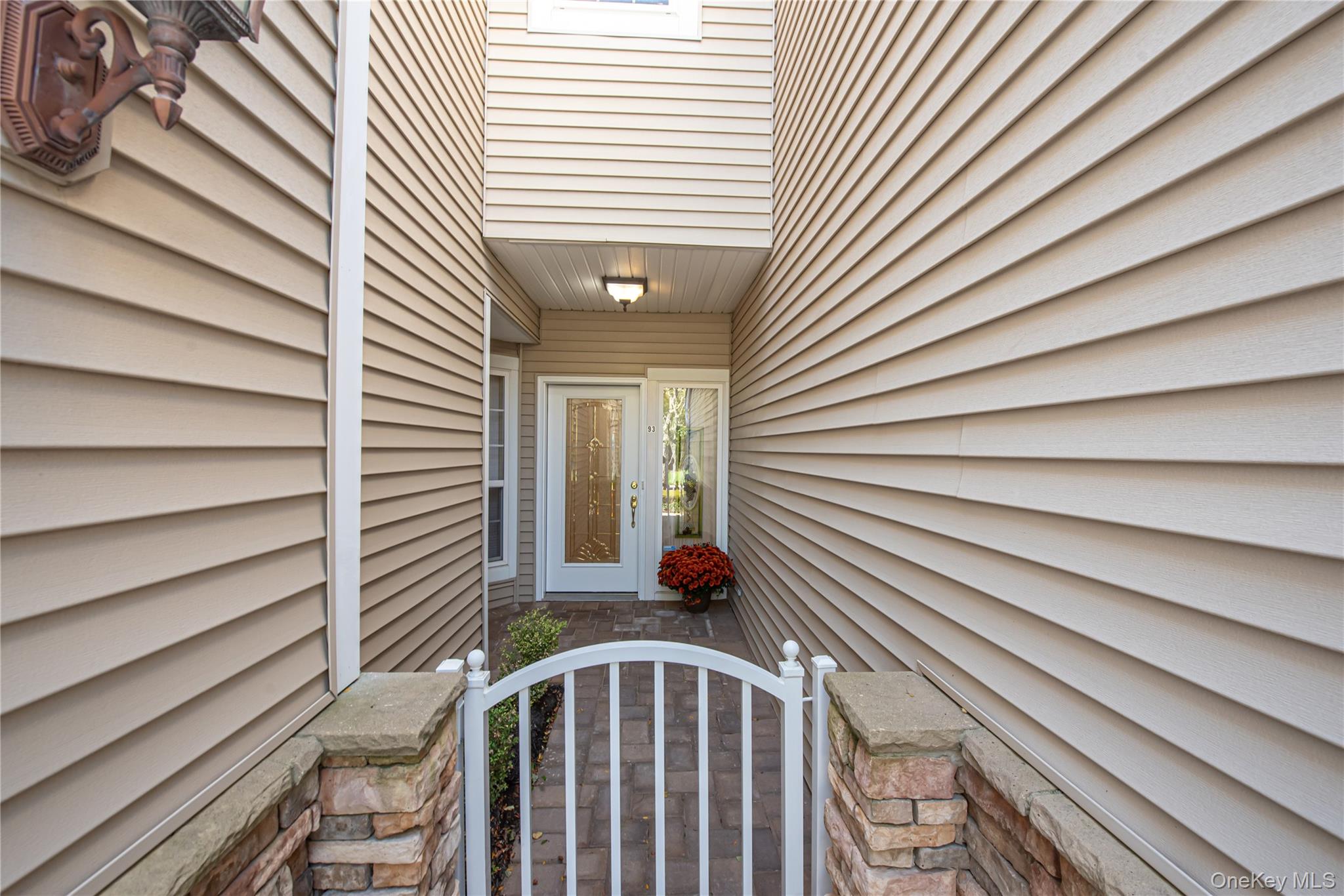 93 Carriage Lane, Unit AVON LOWER Plainview, NY 11803 - Photo 4 of 36 a view of balcony with two chairs
