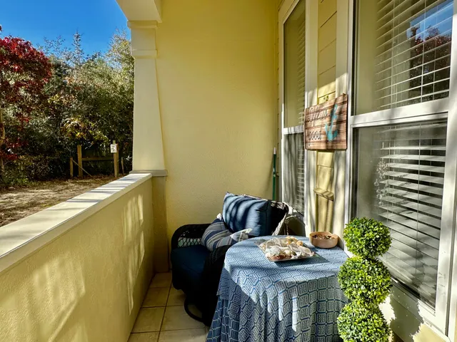 a room with furniture and a potted plant