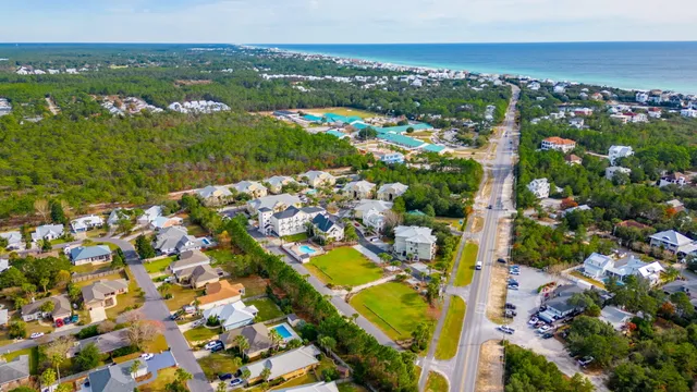 an aerial view of residential houses with outdoor space