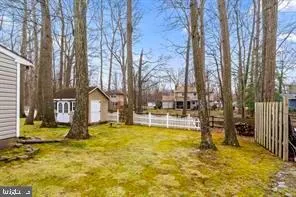 a view of a swimming pool with an outdoor space and seating area