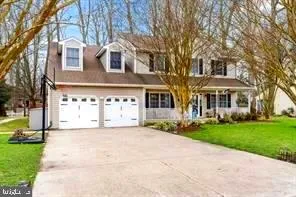 a front view of a building with a garden