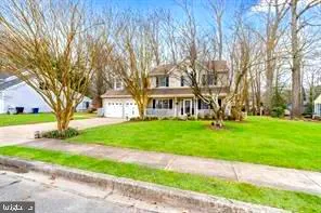a view of a yard with a house in the background