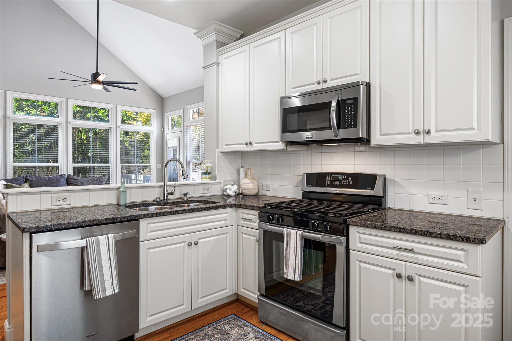 126 Blandina Court Fort Mill, SC 29708 - Photo 13 of 33 a kitchen with cabinets appliances a sink and a window