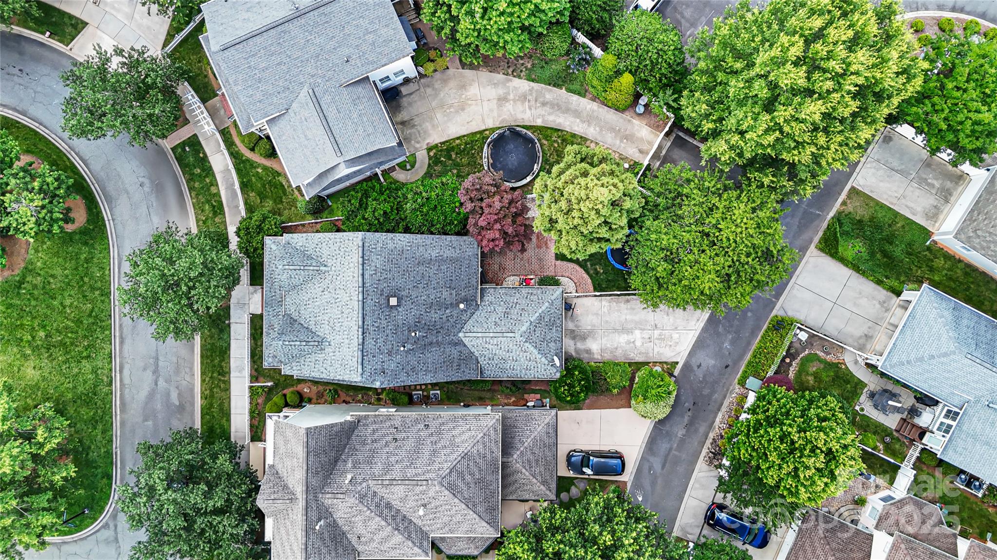 126 Blandina Court Fort Mill, SC 29708 - Photo 26 of 33 an aerial view of a house with a garden and trees