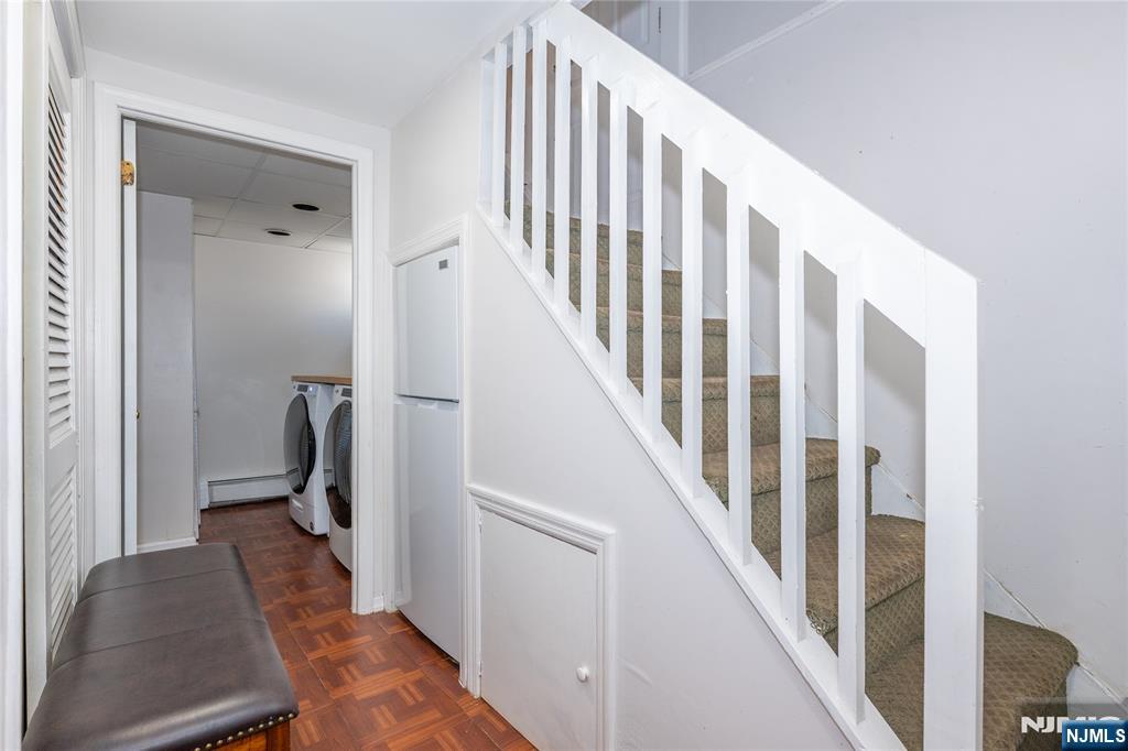 690 Garden Street Maywood, NJ 07607 - Photo 28 of 49 a view of a hallway with wooden floor and stairs