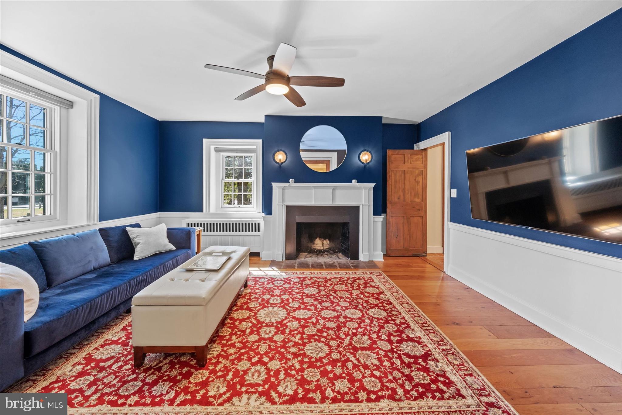 1439 Old Wilmington Road Hockessin, DE 19707 - Photo 12 of 57 a living room with furniture and a fireplace