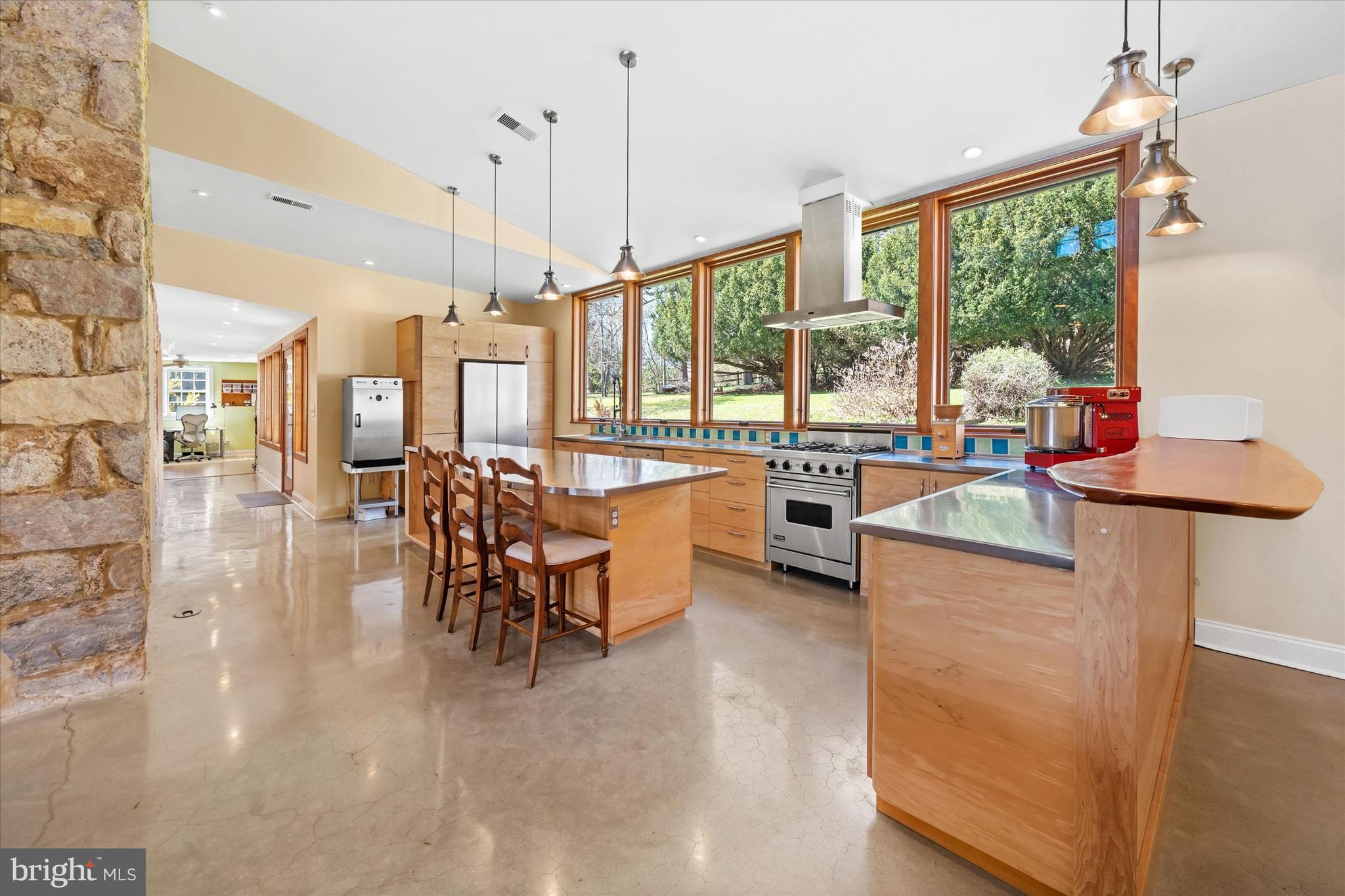 1439 Old Wilmington Road Hockessin, DE 19707 - Photo 17 of 57 a very nice looking living room with a large window and dining table