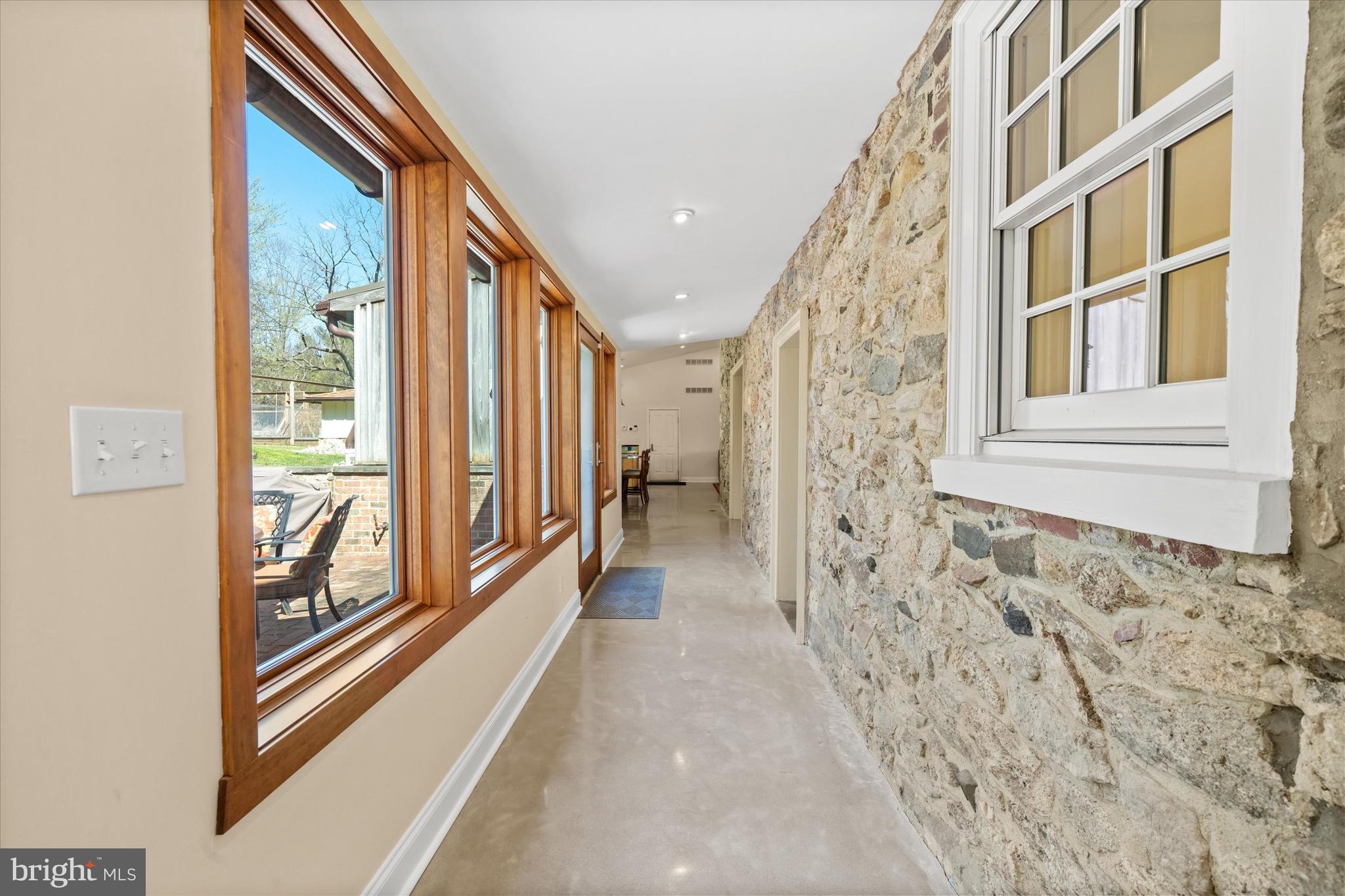 1439 Old Wilmington Road Hockessin, DE 19707 - Photo 27 of 57 a view of a hallway with windows
