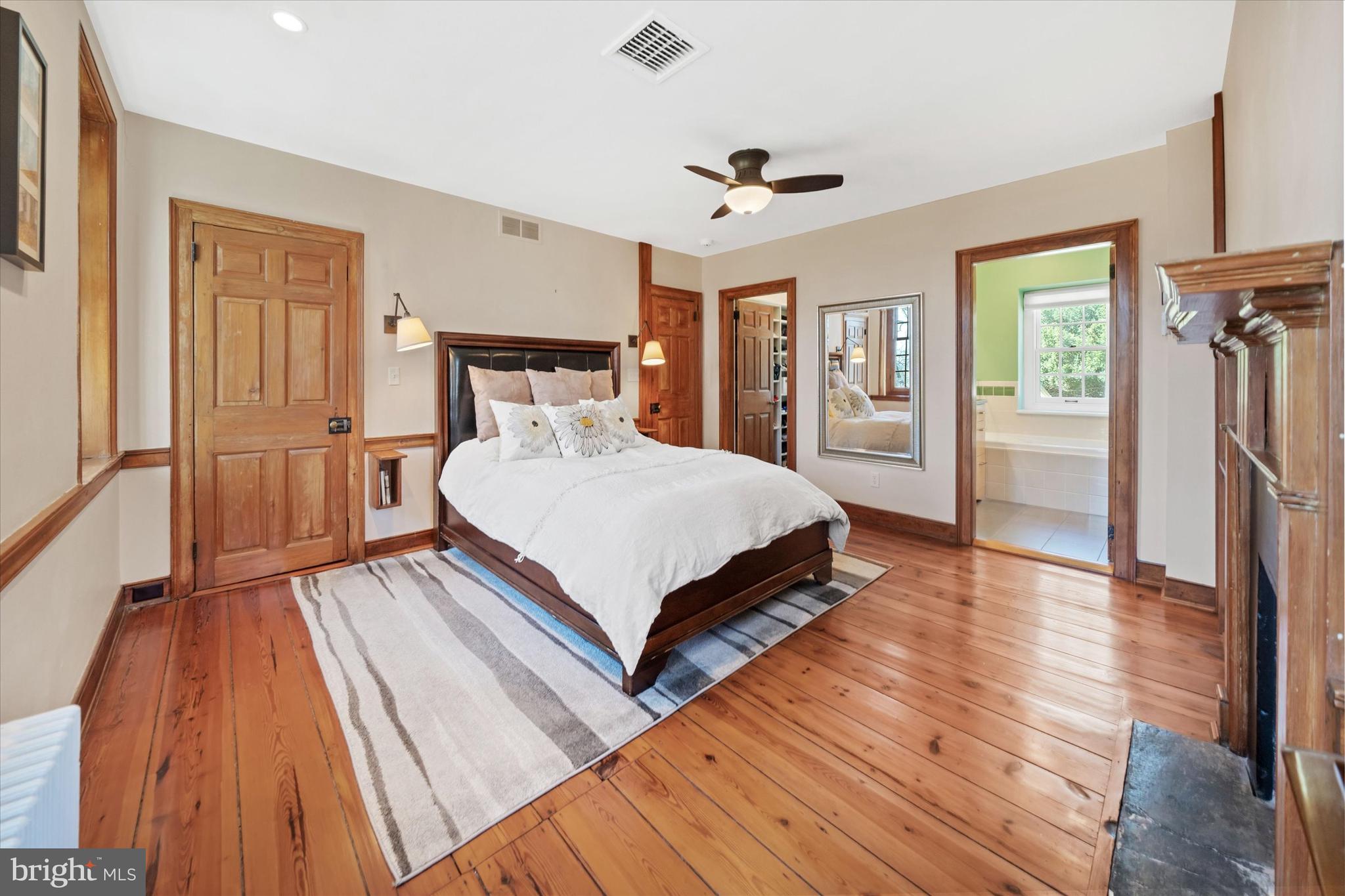 1439 Old Wilmington Road Hockessin, DE 19707 - Photo 31 of 57 a bedroom with a bed and wooden floor