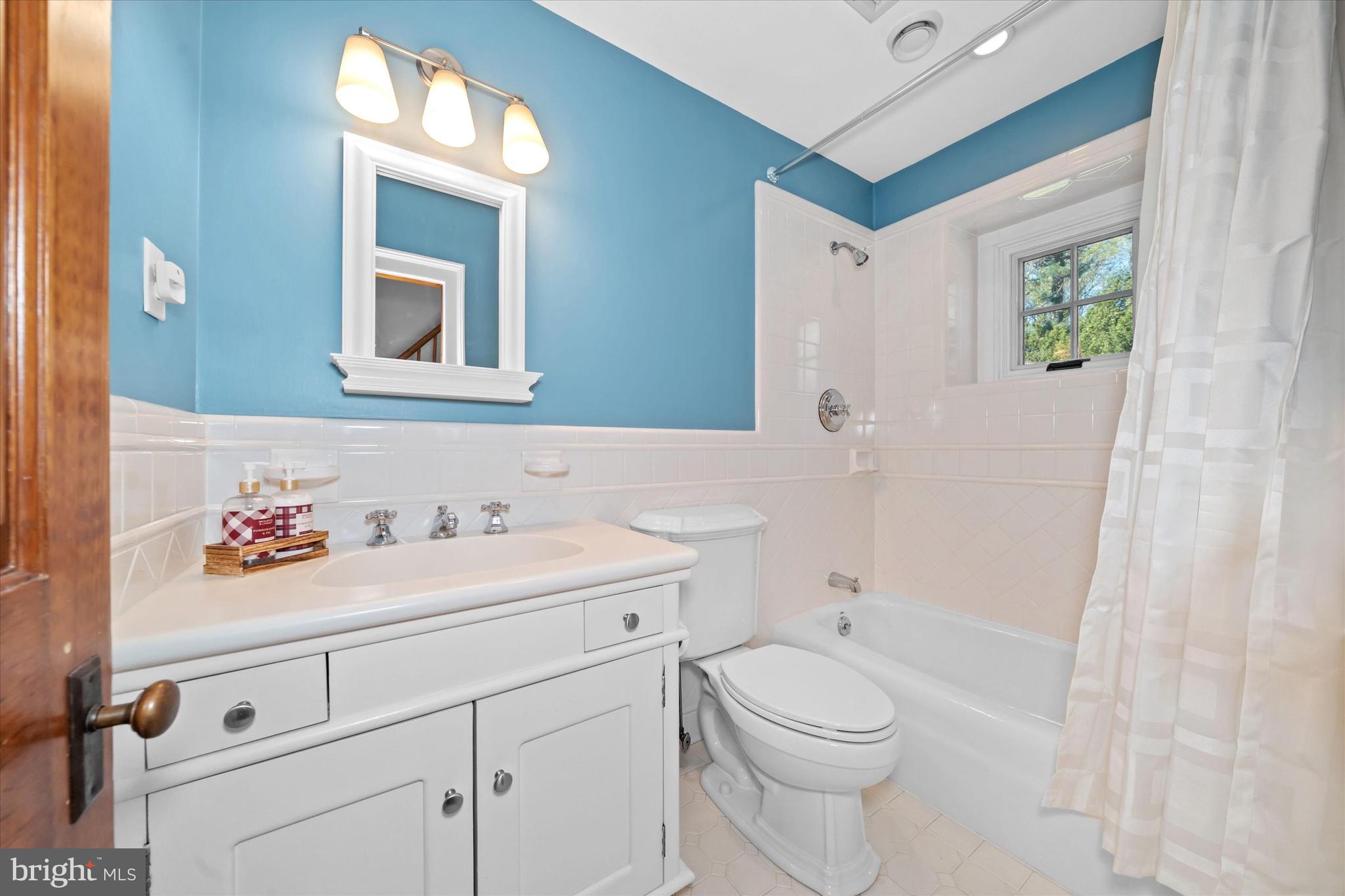 1439 Old Wilmington Road Hockessin, DE 19707 - Photo 37 of 57 a bathroom with a toilet a sink and mirror