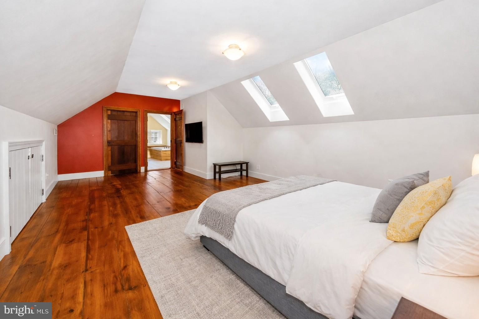 1439 Old Wilmington Road Hockessin, DE 19707 - Photo 39 of 57 a spacious bedroom with a bed and a large mirror