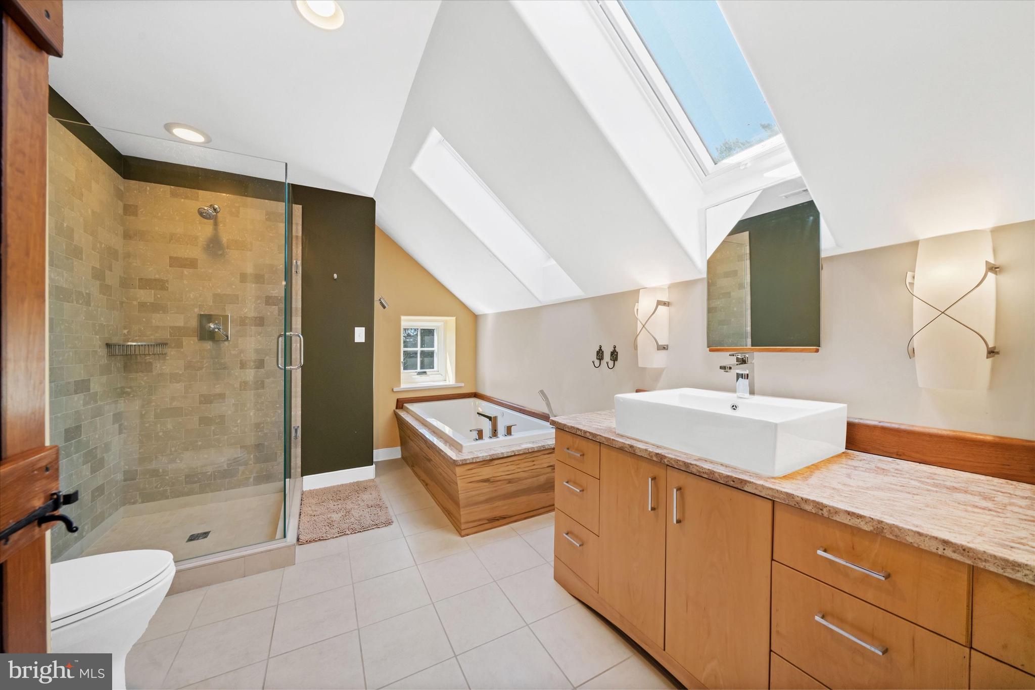 1439 Old Wilmington Road Hockessin, DE 19707 - Photo 40 of 57 a spacious bathroom with a granite countertop sink mirror and shower
